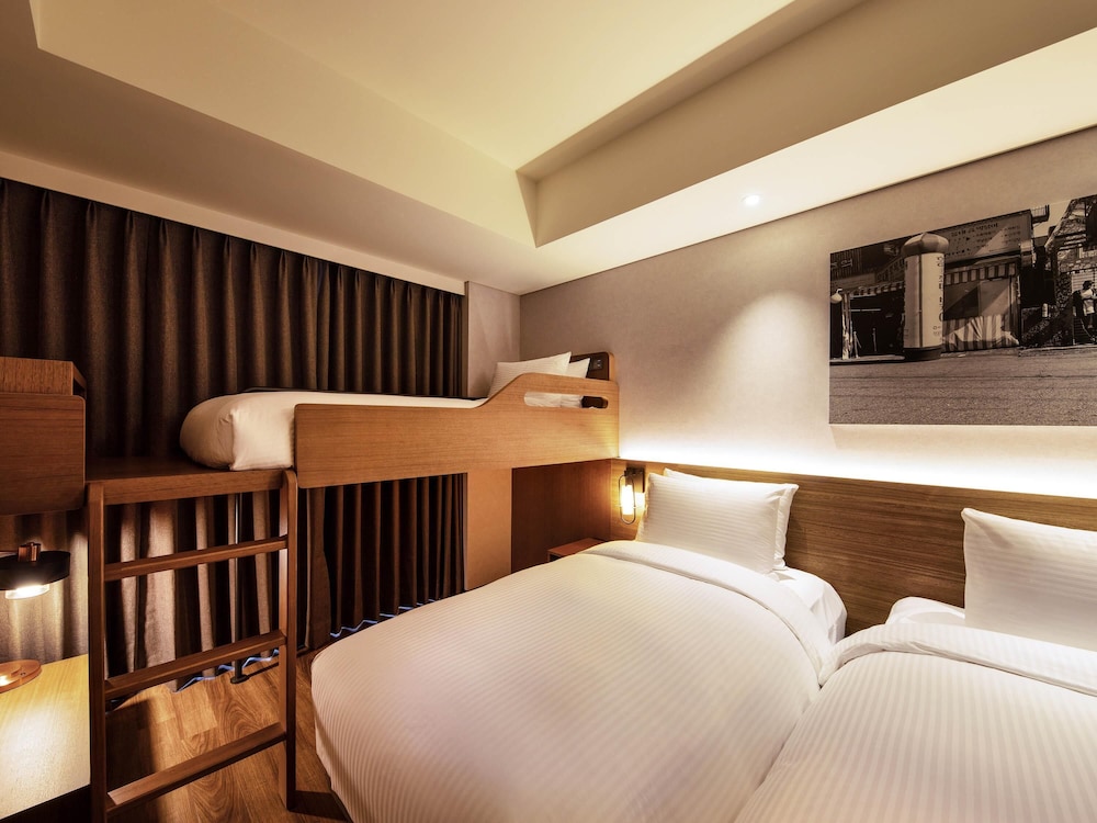 Habitación superior, 3 camas individuales del hotel Mercure Ambassador Seoul Hongdae. Foto 3