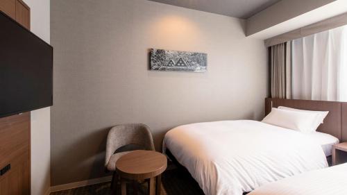 Habitación Doble Estándar - 2 camas del hotel KOKO HOTEL Hidatakayama. Foto 4