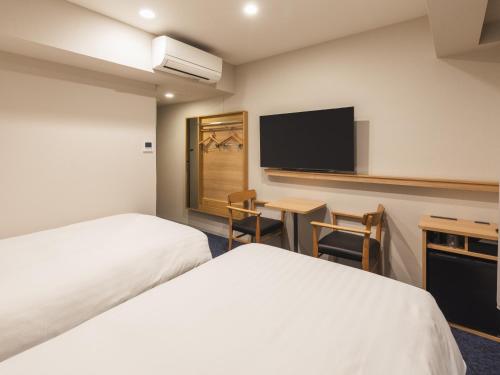 Habitación Doble Estándar - 2 camas - No fumadores del hotel Sotetsu Fresa Inn Hiroshima. Foto 2