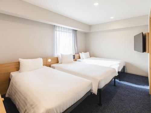 Habitación Triple Superior - No fumadores del hotel Sotetsu Fresa Inn Hiroshima. Foto 4