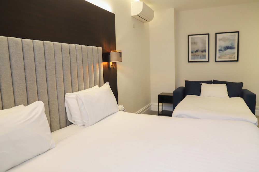 Habitación familiar, varias camas del hotel Rove London Paddington. Foto 2