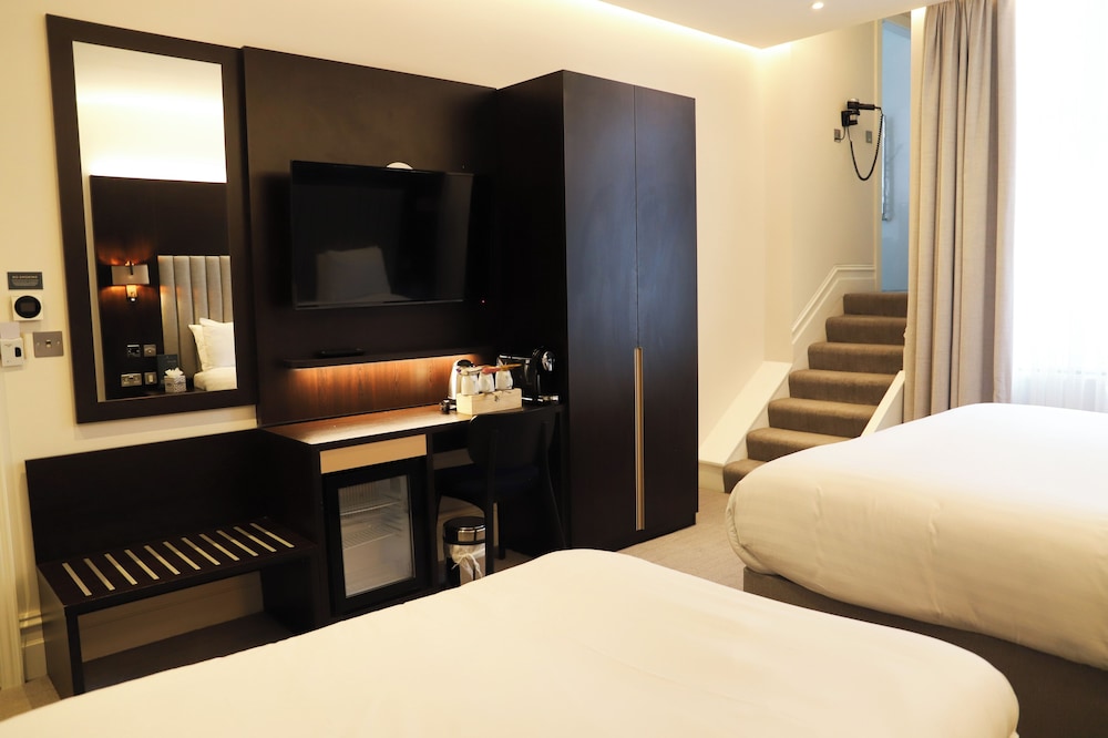 Habitación familiar, varias camas del hotel Rove London Paddington. Foto 3