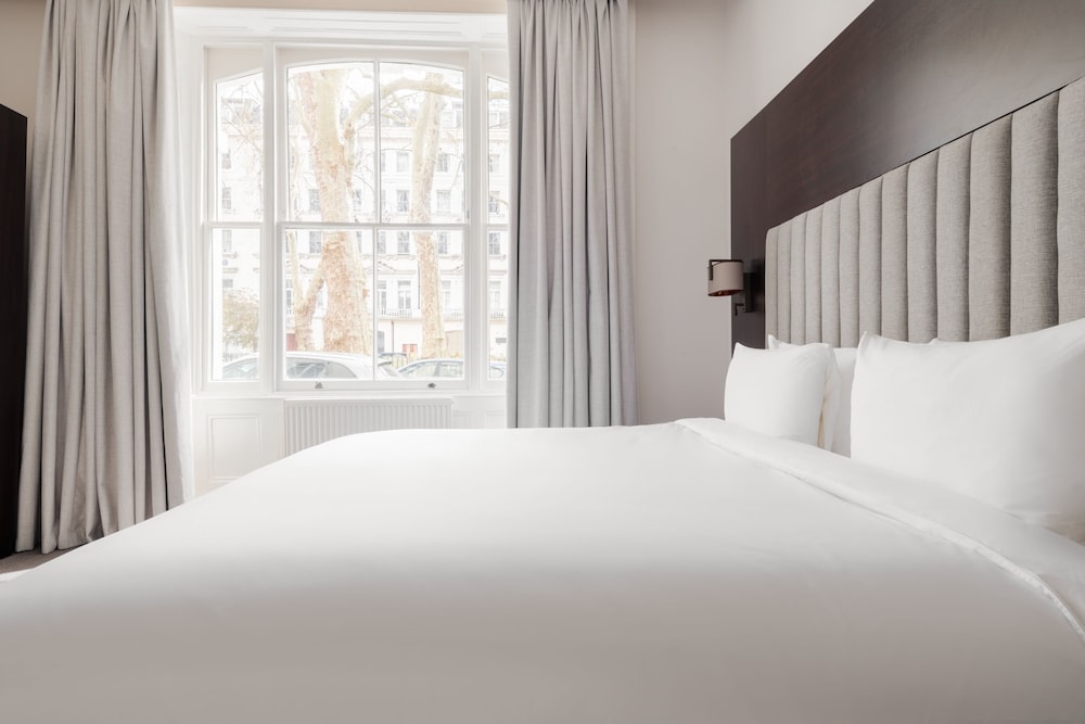 Habitación estándar con 1 cama doble o 2 individuales del hotel Rove London Paddington. Foto 4