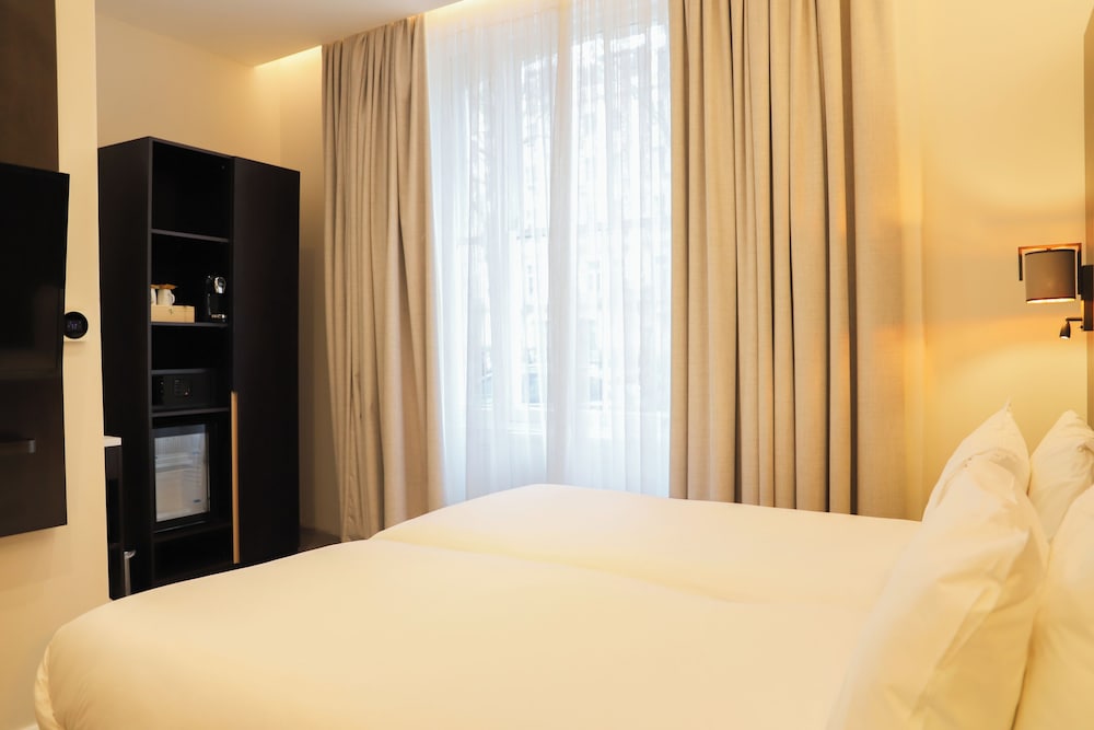 Habitación estándar con 1 cama doble o 2 individuales del hotel Rove London Paddington. Foto 6