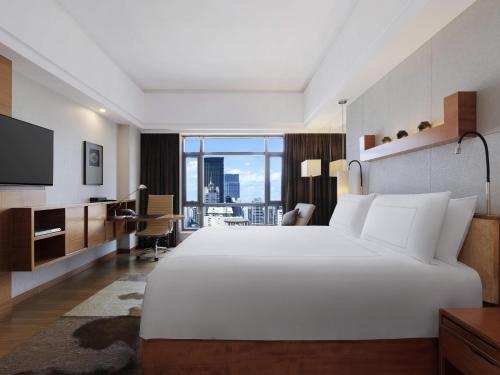 Habitación King Ejecutiva Suiza del hotel Swissotel Grand Shanghai. Foto 7