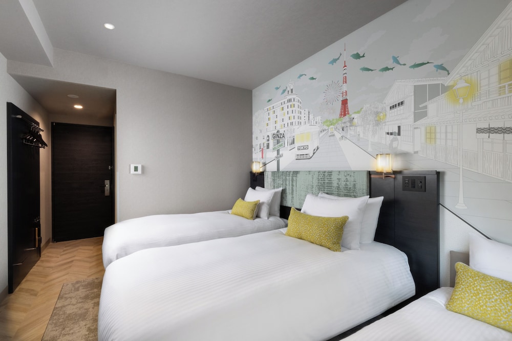 Habitación Superior con 2 camas individuales y 1 sofá - cama del hotel ibis Styles Tokyo Ginza East. Foto 16