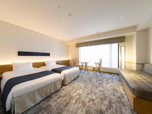Habitación familiar 2 Camas individuales del hotel Tokyu Stay Hida-takayama Musubi No Yu. Foto 9