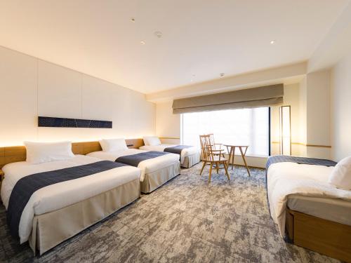 Habitación familiar 2 Camas individuales del hotel Tokyu Stay Hida-takayama Musubi No Yu. Foto 10