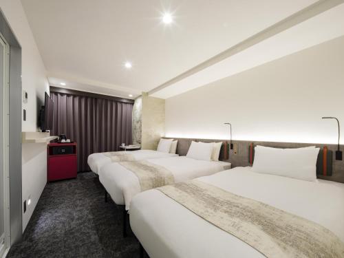 Habitación Triple del hotel the b ginza. Foto 5