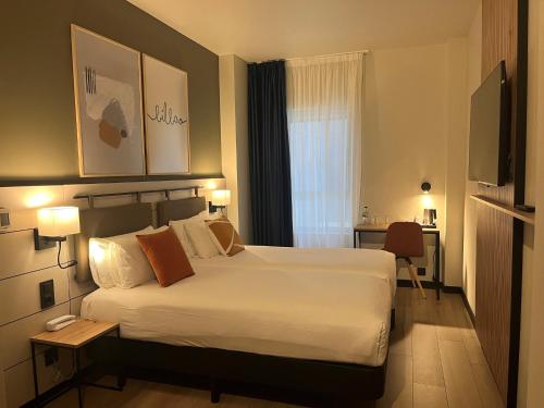 Habitación Doble Estándar - 2 camas del hotel voco Bilbao - City by IHG. Foto 3
