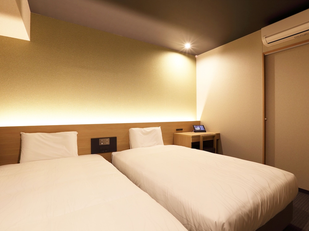 Habitación superior con 2 camas individuales del hotel Henn Na Kanazawa Korinbo. Foto 2