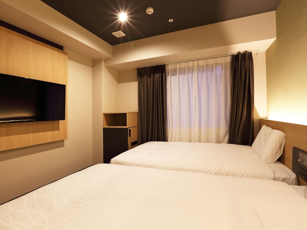 Habitación superior con 2 camas individuales del hotel Henn Na Kanazawa Korinbo. Foto 3