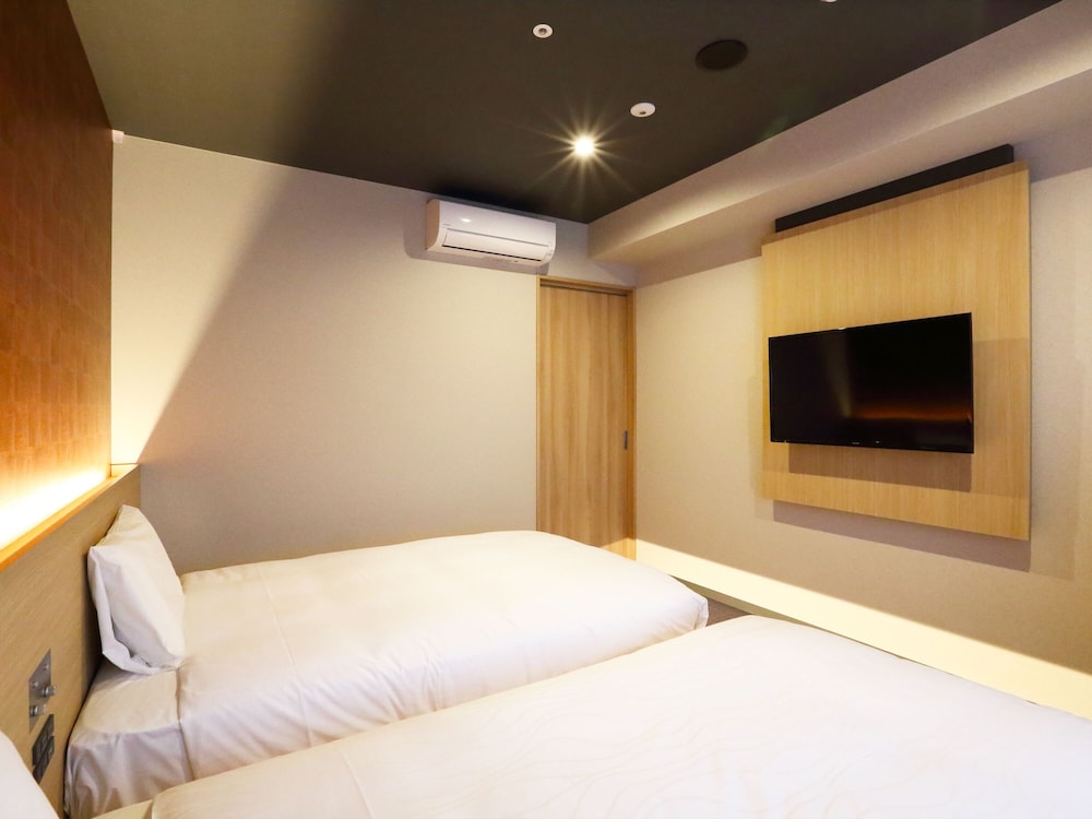 Habitación con 2 camas individuales (Japanesque) del hotel Henn Na Kanazawa Korinbo. Foto 2