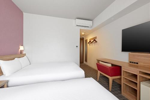 Habitación Doble - No fumadores - 2 camas del hotel Sotetsu Fresa Inn Osaka Shinsaibashi. Foto 4