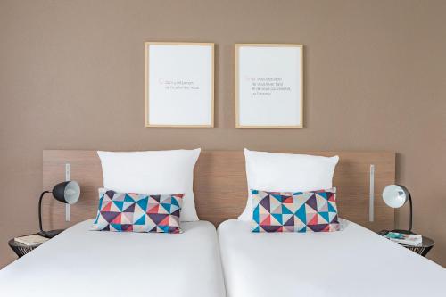 Estudio con 2 camas individuales del hotel Appart'city Classic Paris La Villette. Foto 4
