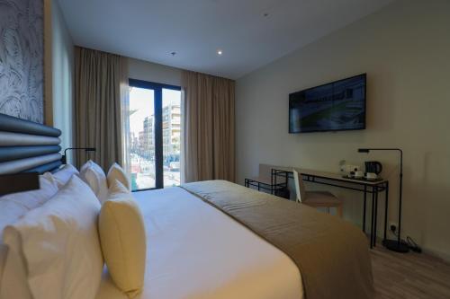 Habitación Triple Deluxe del hotel Abba Sevilla. Foto 2