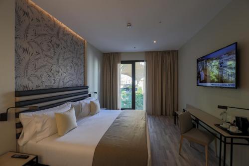 Habitación Triple Deluxe del hotel Abba Sevilla. Foto 3