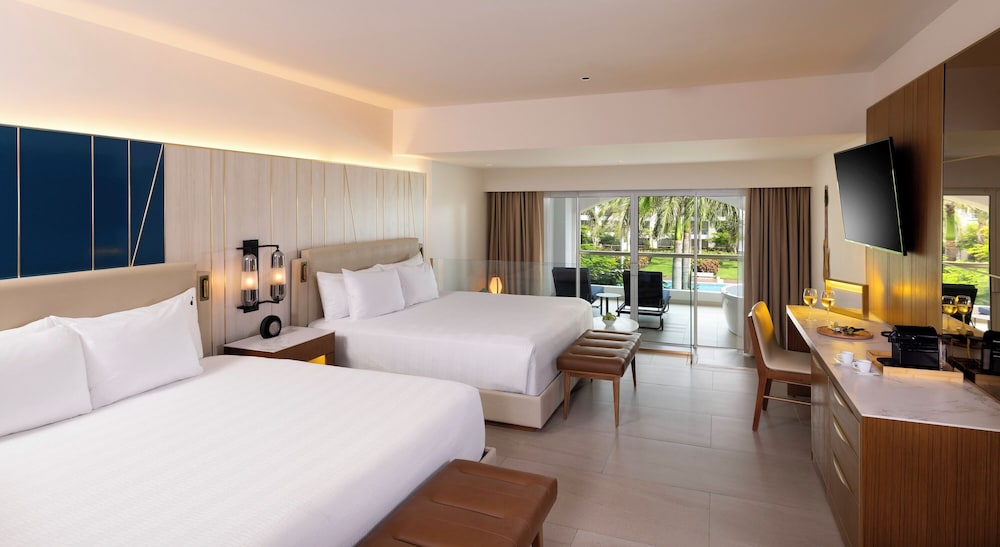Islander Junior Suite Dos Camas King y Sofá Cama del hotel Hard Rock and Casino Punta Cana All Inclusive. Foto 2