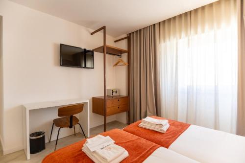 Habitación Doble Estándar - 2 camas del hotel The Icons Lisbon Central. Foto 4