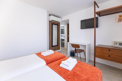 Habitación Doble Estándar - 2 camas del hotel The Icons Lisbon Central. Foto 7