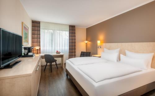 Habitación Superior con cama extragrande del hotel Sunday Bielefeld Johannisberg. Foto 10