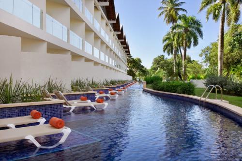 Alojamiento Preferred Club con vistas al jardín y acceso directo a la piscina - 2 camas grandes del hotel Dreams La Romana All-Inclusive Resort and Spa