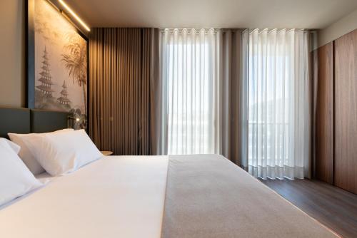 Habitación Doble con balcón - 1 o 2 camas del hotel Exe Essenzia Porto. Foto 1
