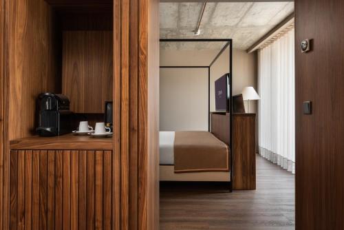Suite Junior con balcón del hotel Exe Essenzia Porto. Foto 3