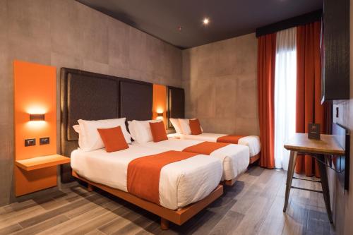 Habitación Triple Estándar del hotel J24 Milano. Foto 2