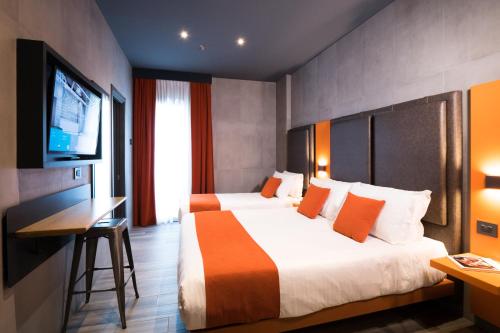Habitación Triple Estándar del hotel J24 Milano. Foto 5