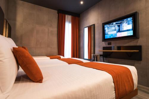 Habitación Triple Estándar del hotel J24 Milano. Foto 6