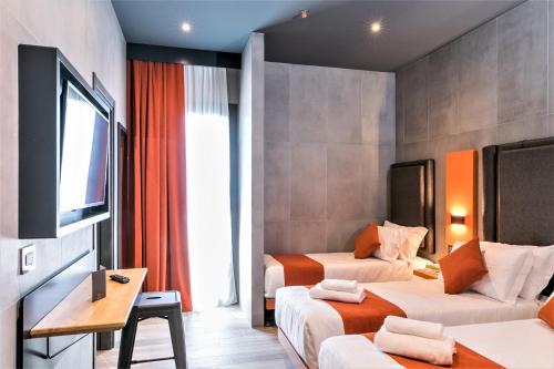Habitación Cuádruple Estándar del hotel J24 Milano. Foto 1