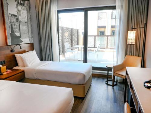 Habitación superior con 2 camas individuales del hotel ibis Styles Dubai Gold District