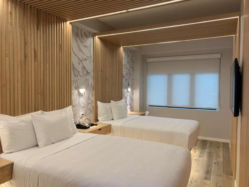 Habitación Doble Estándar con 2 camas dobles del hotel Best Western Plus Soho