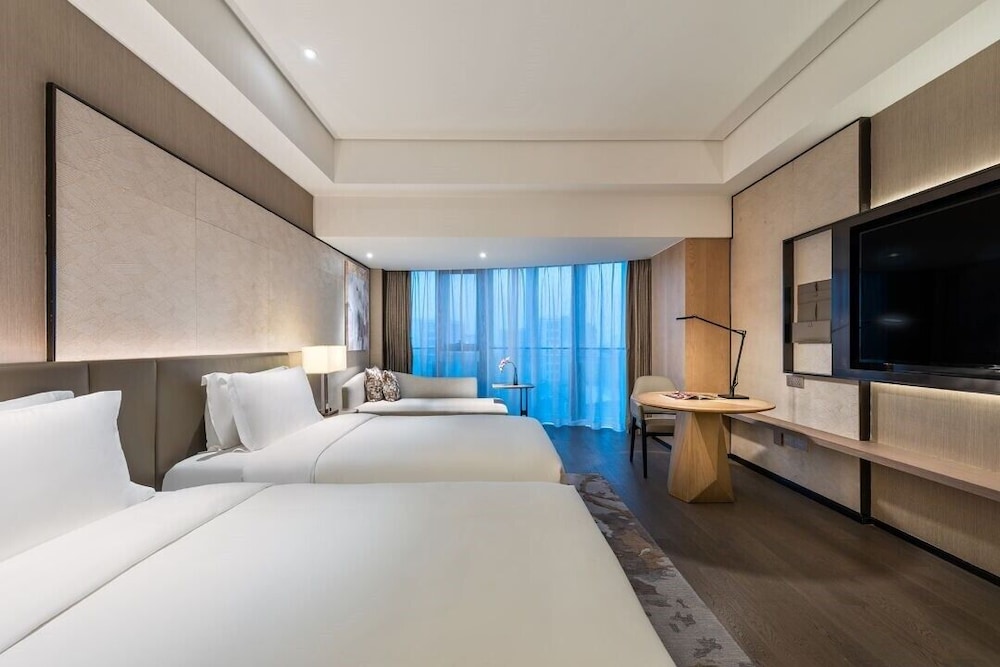 Habitación superior, 2 camas individuales del hotel Grand Mercure Shanghai Lingang. Foto 1