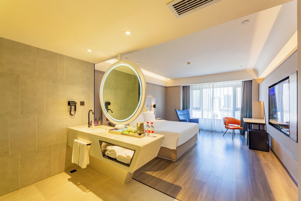 Habitación Deluxe, 1 cama de matrimonio grande del hotel Mercure Harbin West Railway Station. Foto 1