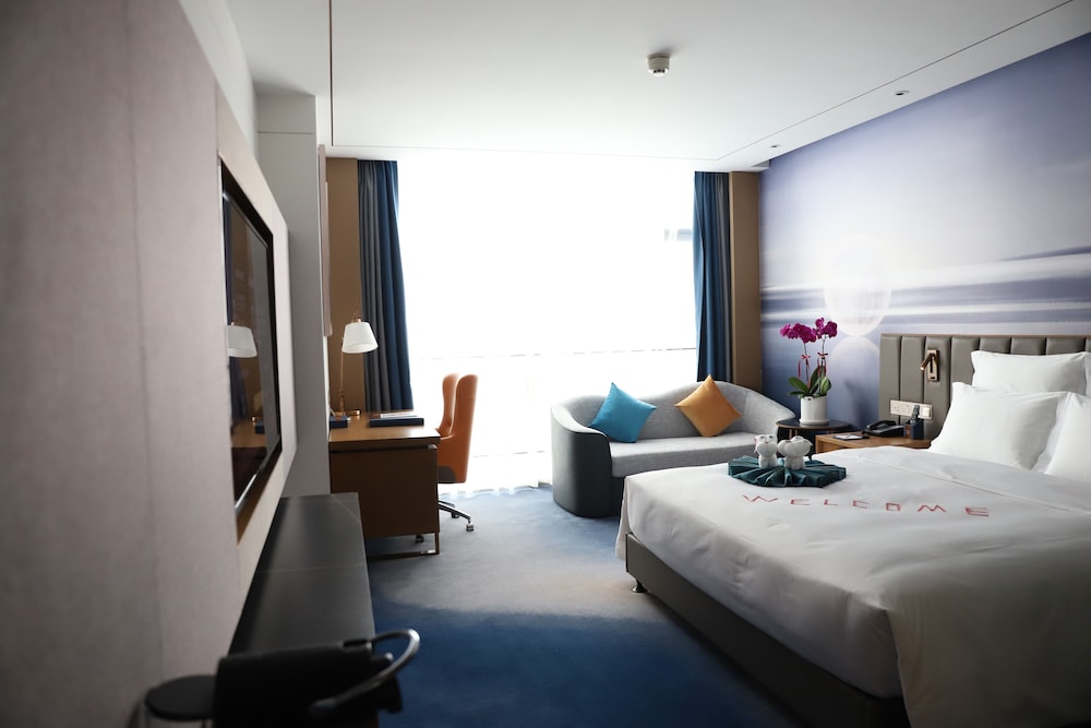 Habitación estándar con 2 camas individuales del hotel Novotel Changsha Intl Exhibition Center. Foto 1