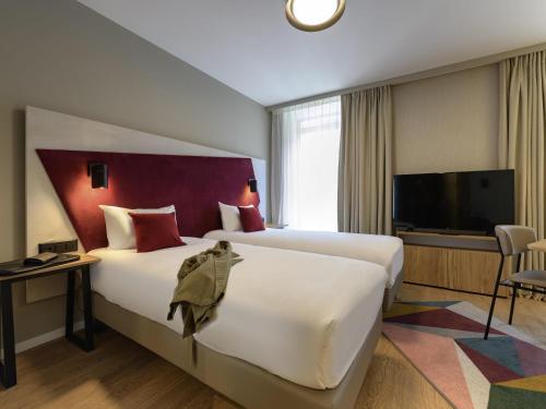 Estudio con 2 camas individuales del hotel Adagio Zurich Center. Foto 2