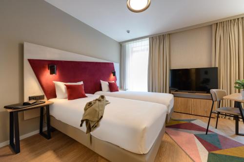 Estudio con 2 camas individuales del hotel Adagio Zurich Center. Foto 3