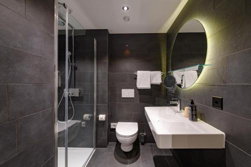 Estudio con 2 camas individuales del hotel Adagio Zurich Center. Foto 7
