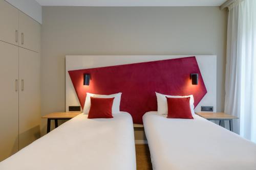 Estudio con 2 camas individuales del hotel Adagio Zurich Center. Foto 8