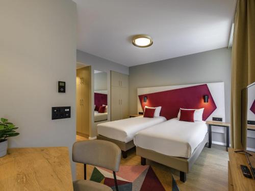 Estudio con 2 camas individuales del hotel Adagio Zurich Center. Foto 12