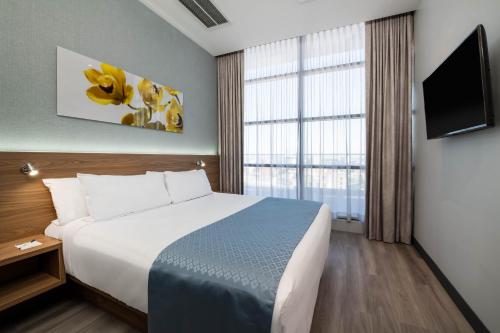 Suite King - No fumadores del hotel Wingate by Wyndham Long Island City. Foto 1