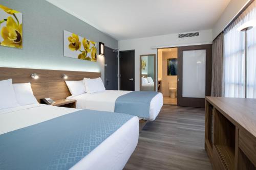 Habitación Doble con 2 camas dobles - Se admiten mascotas - No fumadores del hotel Wingate by Wyndham Long Island City. Foto 2