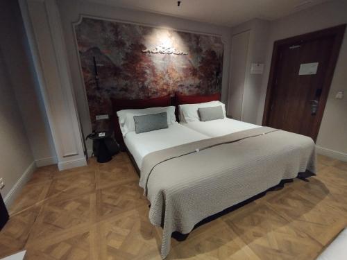 Habitación Triple del hotel Soho Boutique Palacio de Pombo