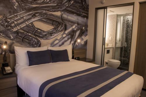 Habitación Superior - 1 cama grande del hotel Carnegie. Foto 12