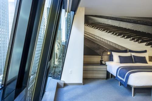 Suite Junior Superior con cama extragrande del hotel Carnegie. Foto 10