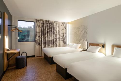 Habitación Cuádruple del hotel B&B Nice Aéroport Arenas. Foto 9