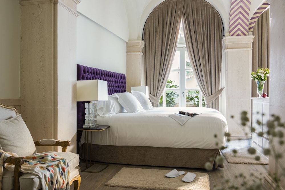 Suite Premium, en la zona del patio del hotel Casa De Triana Luxury Suites By Casa Del Poeta