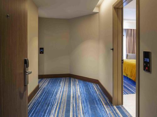 Habitación Clásica Twin Conectada del hotel Mövenpick Istanbul Asia Airport. Foto 2